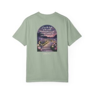 Green Christian t-shirt with John 8:12 scripture, lit stairway path with flowers and sunset design.