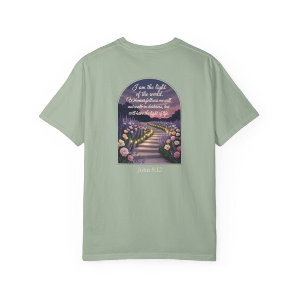 Green Christian t-shirt with John 8:12 scripture, lit stairway path with flowers and sunset design.