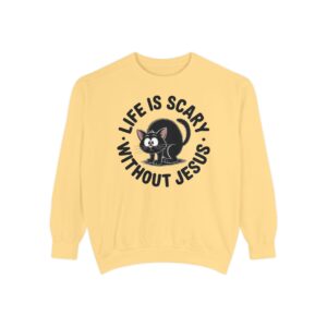 Model on a Halloween set wearing a yellow Life is Scary Without Jesus Halloween Sweatshirt, design showing a cute frightened black cat.