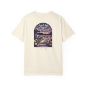 Ivory Christian t-shirt with John 8:12 scripture, lit stairway path with flowers and sunset design.