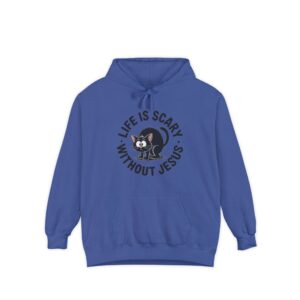 Model on a Halloween set wearing a blue Life is Scary Without Jesus Halloween Hoodie, design showing a cute frightened black cat.