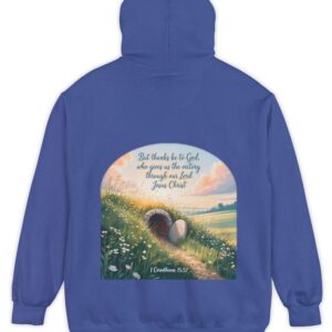 Royal blue Comfort Colors hoodie sweatshirt with a field and an open tomb with the rock rolled away. Printed on it is 1 Corinthians 15:57 But thanks be to God, who gives us the victory through our Lord Jesus Christ.