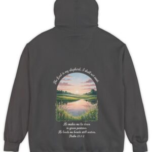 Dark grey Comfort Color hoodie sweatshirt with a meadow, pond and wildflowers with The Lord is my shepherd, I shall not want. He makes me lie down in green pastures. He leads me beside still waters. printed on it. Psalm 23:1-2