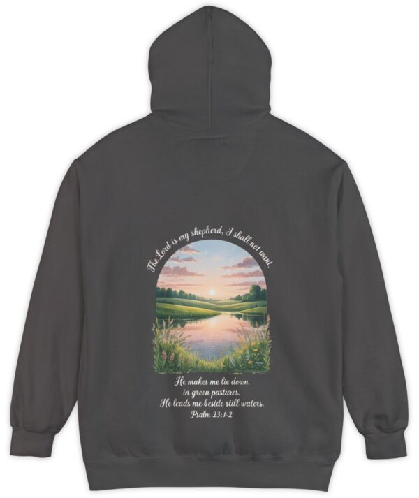 Dark grey Comfort Color hoodie sweatshirt with a meadow, pond and wildflowers with The Lord is my shepherd, I shall not want. He makes me lie down in green pastures. He leads me beside still waters. printed on it. Psalm 23:1-2