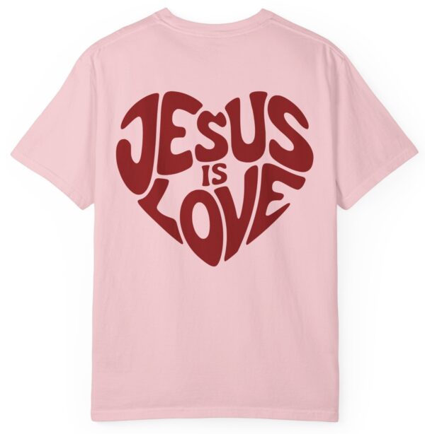 Light pink Comfort Colors Jesus is Love Christian t-shirt with a red printed heart that forms the words "Jesus is Love".
