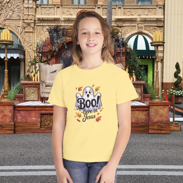 Boo-lieve in Jesus Kids Tee – Fall Christian Shirt Sizes XS to XL 3 Model of Boo-lieve in Jesus Kids Tee – Fall Christian Shirt Sizes XS to XL 2